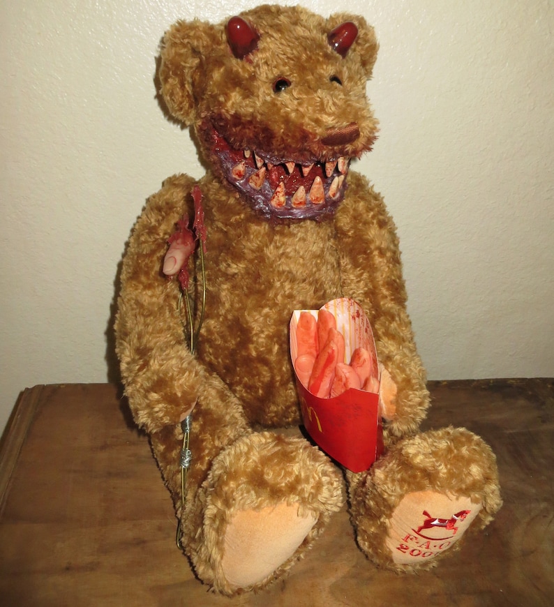 teddy bear with human teeth