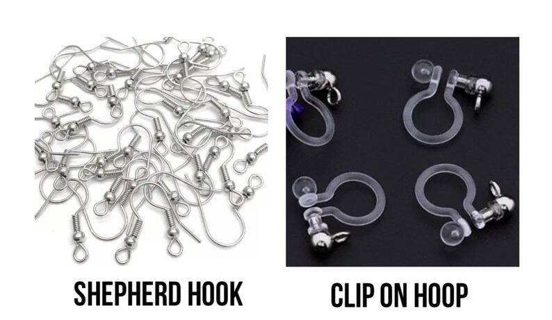 May include: A close-up of two types of earring findings: silver shepherd hooks and clear plastic clip-on hoops.  SHEPHERD HOOK and CLIP ON HOOP are written below each type of finding.