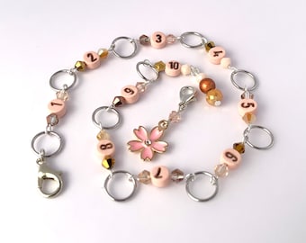 Row counter chain available with 8mm or 10mm diameter rings with Cherry blossom charm & crystal Beads