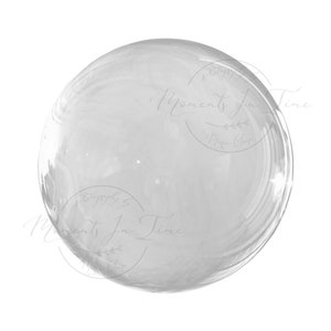 May include: A clear glass sphere with a smooth, reflective surface. The sphere is isolated against a white background.