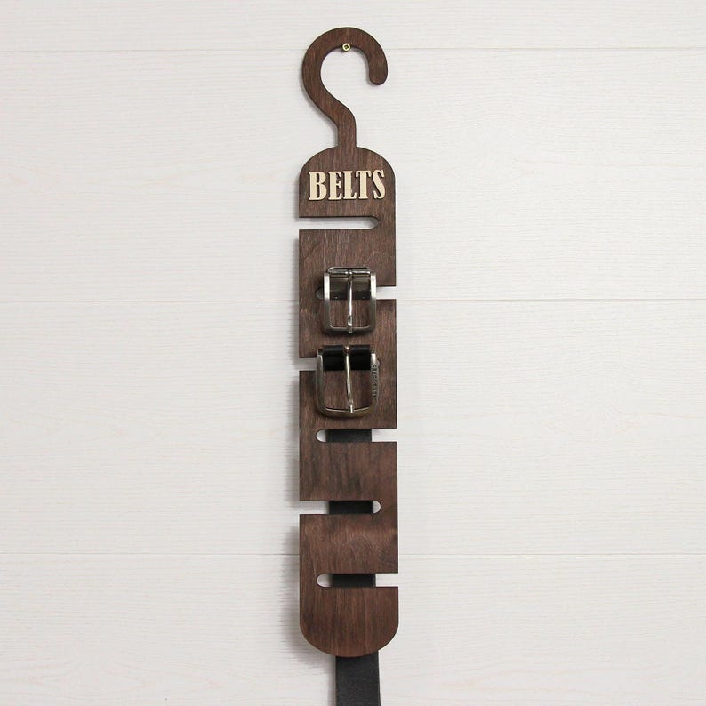 Rustic wooden belt hanger for men, handmade belt organizer with 3D BELTS letters, gift for him or dad
Wooden belt rack for closet organization, handmade gift for husband or boyfriend

Belt holder for wardrobe, wooden hanger with BELTS sign, men’s accessories organizer
Wooden belt hanger inside modern closet, space-saving belt organizer for men
Gift-ready wooden belt rack, rustic home accessory, perfect Father’s Day gift
Handmade plywood belt organizer, natural wood finish, functional men’s gift
