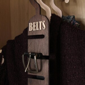 Rustic wooden belt hanger for men, handmade belt organizer with 3D BELTS letters, gift for him or dad
Wooden belt rack for closet organization, handmade gift for husband or boyfriend

Belt holder for wardrobe, wooden hanger with BELTS sign, men’s accessories organizer
Wooden belt hanger inside modern closet, space-saving belt organizer for men
Gift-ready wooden belt rack, rustic home accessory, perfect Father’s Day gift
Handmade plywood belt organizer, natural wood finish, functional men’s gift