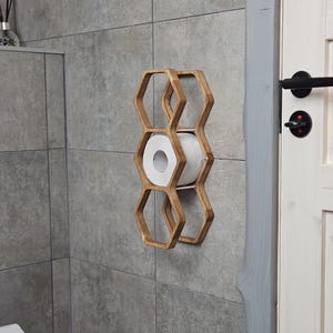 toilet paper wall rack, natural wood TP holder, compact hexagon shelf, wall-mounted honeycomb rack, stylish rustic bathroom decor, floating toilet paper shelf, lightweight bathroom organizer, wood toilet roll storage, hexagon tissue holder, modern farmhouse accessory