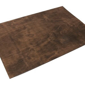 May include: A brown woodgrain textured sheet of plywood.