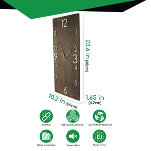 May include: A brown wooden wall clock with white numbers and hands. The clock is 23.6 inches tall and 10.2 inches wide. It is made of high quality plywood and is super silent.