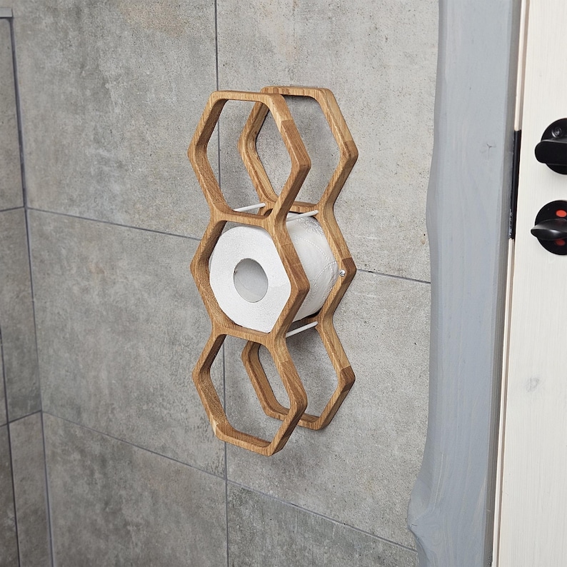 hexagon toilet paper wall holder, handmade wood roll rack, bathroom decor toilet holder, floating tissue organizer, rustic wood wall mount shelf, toilet paper storage idea, modern wood toilet rack, honeycomb toilet roll mount, toilet tissue shelf, bathroom wooden accessory