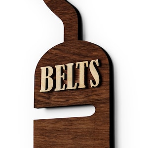 Rustic wooden belt hanger for men, handmade belt organizer with 3D BELTS letters, gift for him or dad
Wooden belt rack for closet organization, handmade gift for husband or boyfriend

Belt holder for wardrobe, wooden hanger with BELTS sign, men’s accessories organizer
Wooden belt hanger inside modern closet, space-saving belt organizer for men
Gift-ready wooden belt rack, rustic home accessory, perfect Father’s Day gift
Handmade plywood belt organizer, natural wood finish, functional men’s gift