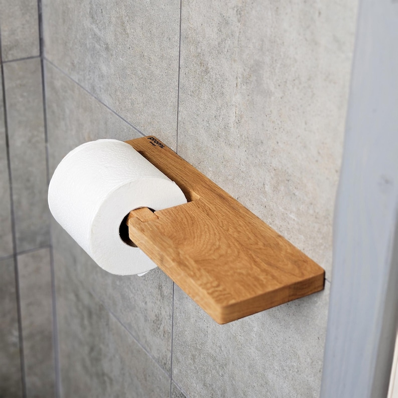 Artisanal Wooden Roll Holder with Extra Storage
Handcrafted from high-quality wood, this artisanal toilet paper roll holder features a unique design with an extra storage shelf. Its natural finish and detailed craftsmanship bring warmth and character to your bathroom, combining practicality with a bespoke aesthetic.