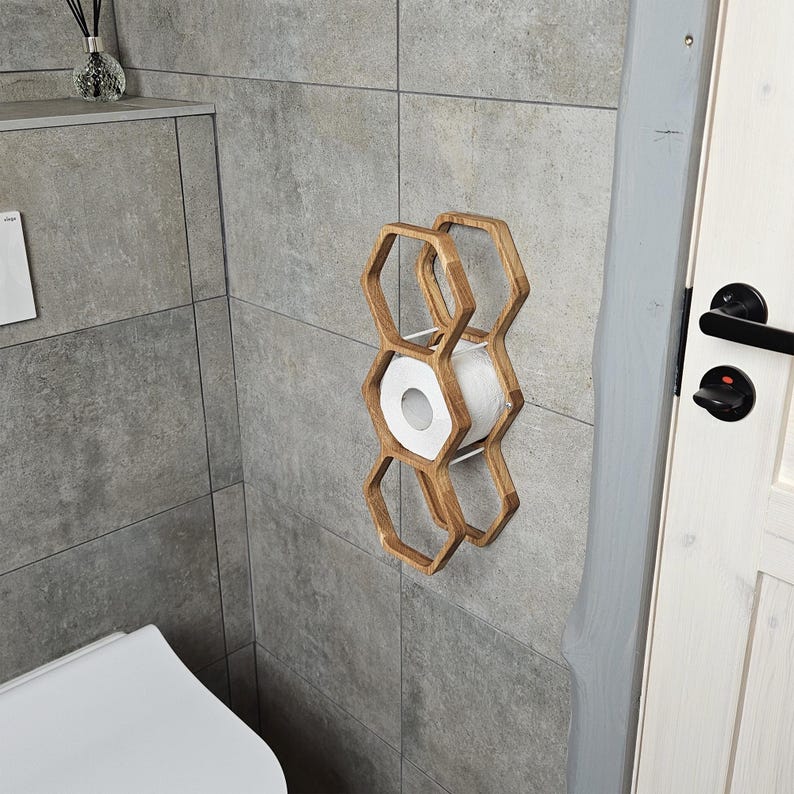 wall mounted toilet roll holder, handmade wood toilet paper rack, floating bathroom storage shelf, honeycomb TP dispenser, rustic wood bathroom shelf, toilet roll display, wooden tissue paper wall mount, farmhouse toilet rack, modern rustic toilet storage, hexagon wood shelf