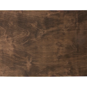 May include: A close-up of a dark brown wood grain surface.