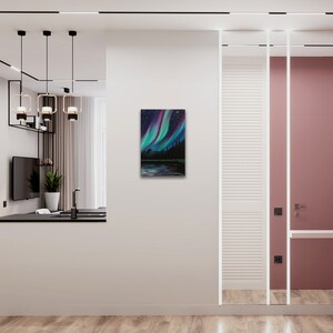 May include: A painting of the aurora borealis, also known as the Northern Lights, over a dark forest and a lake. The sky is a vibrant mix of green, purple, and blue.