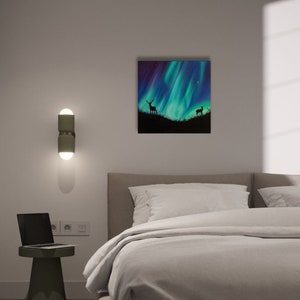 May include: A painting of a green and purple aurora borealis with two deer silhouettes in the foreground.