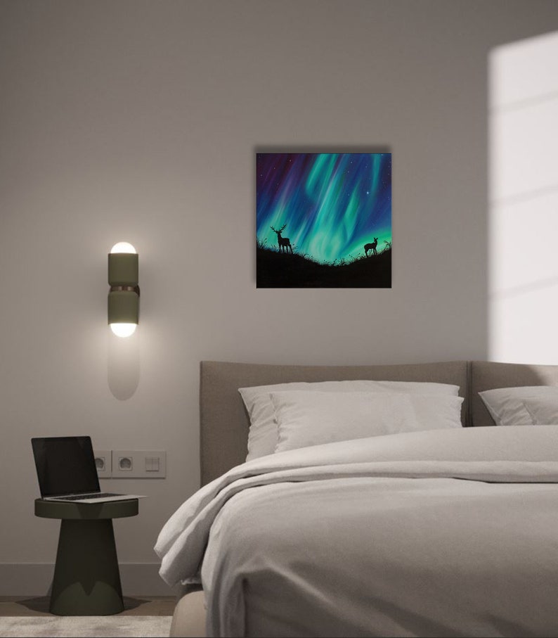 May include: A painting of a green and purple aurora borealis with two deer silhouettes in the foreground.