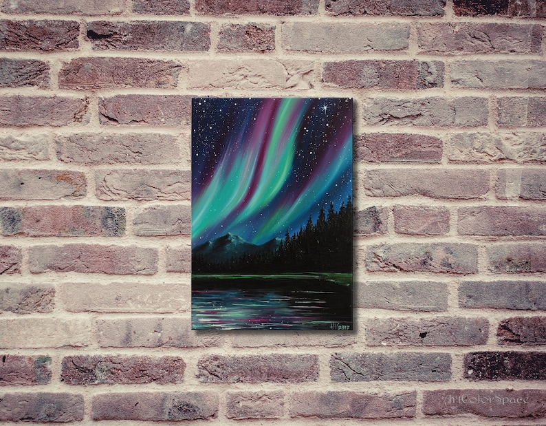 May include: A painting of the aurora borealis, also known as the Northern Lights, over a dark forest and a still lake. The sky is filled with vibrant green, purple, and blue hues, with a scattering of stars.