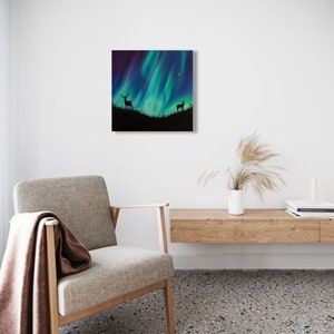 May include: A painting of a silhouette of a deer and a fawn standing in a field under a vibrant green and blue aurora borealis.
