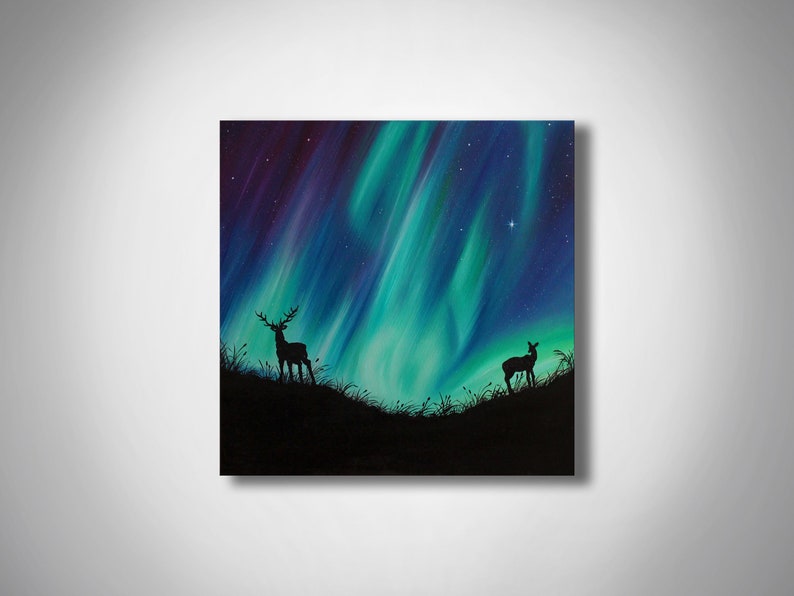 May include: A painting of a deer and a fawn silhouetted against a vibrant green and purple aurora borealis. The sky is filled with stars.