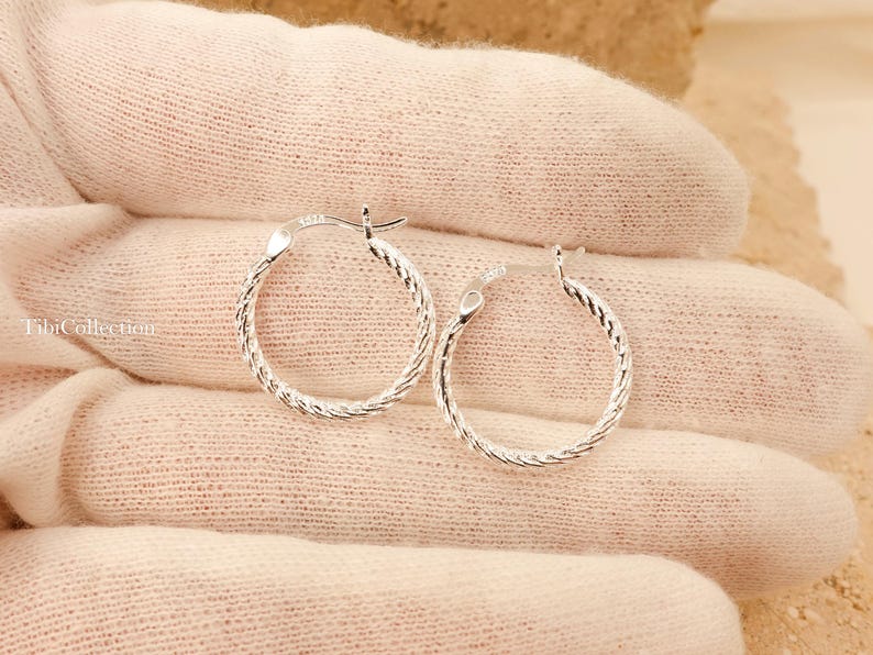 Shiny wavy texture sterling silver thin hoops detail