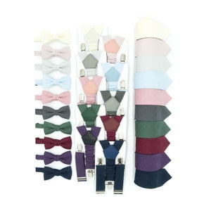 Against a white background, a visually striking arrangement showcases a variety of colors suspenders, bowties, and ties.