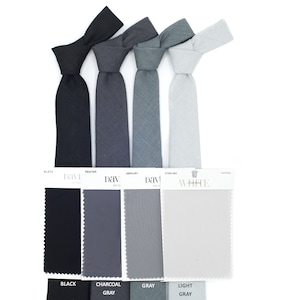 Against a white background, four wedding ties are showcased in colors Black, Pewter, Mercury, and Sterling, each coordinating with samples from David's Bridal.
