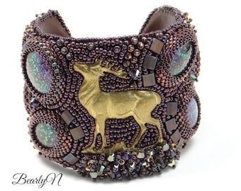 Deer cuff bracelet with a purple burgundy bead embroidery and hand stained glass cabochons, leather lined