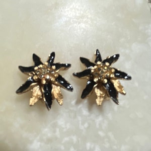 Capri Black and Gold Tone Floral Clip On Earrings