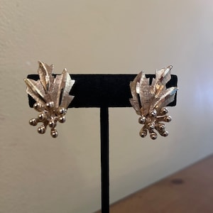BSK Floral Clip On Gold Tone Earrings.