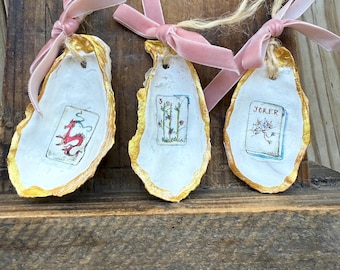 Tumbling Mahjong tiles oyster shell Christmas ornaments with velvet ribbon bow.  Jokers, Flowers, Dragons, Dots, Craks and Bams & Bird Bams