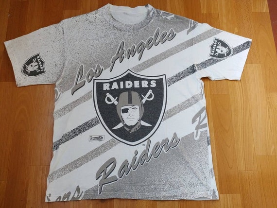 NFL x Flavortown Las Vegas Raiders T-Shirt from Homage. | Officially Licensed Vintage NFL Apparel from Homage Pro Shop.