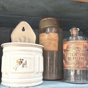 May include: A rustic wooden sign with the text "Welcome to our home" in white lettering. The sign has a distressed finish and a simple, inviting design, suitable for a front porch or entryway.