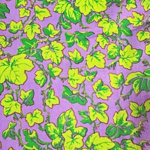 May include: A fabric featuring a repeating pattern of bright lime green ivy leaves with dark green outlines and stems set against a solid light purple background. The leaves are arranged in a dense, overlapping vine-like design across the surface.