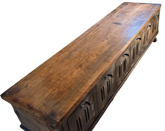 Industrial TV media console with storage.
