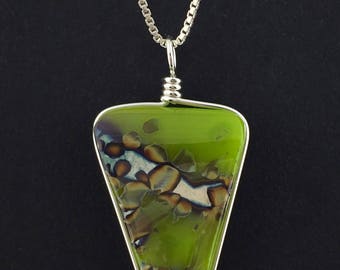 Wire Wrapped Fused Glass Jewelry / Green, silver foil and reactive fused glass wire wrapped pendant
