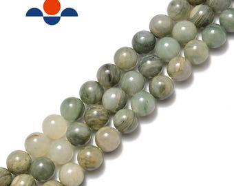 May include: Strands of round, polished beads in shades of green, cream, and tan. The beads have a marbled appearance, with variations in color and pattern. The beads are likely made of a natural stone or mineral, and are strung together.