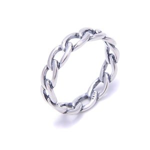 May include: A silver chain link ring. The ring features a continuous chain design, with each link interlocked to form a complete circle. The ring is made of a shiny, metallic material, and the links are smooth and rounded.