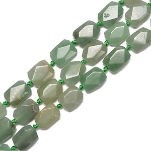 May include: Strands of faceted, light green gemstone beads. The beads are strung on green cord, creating a necklace or bracelet component. The gemstones have a slightly translucent quality, with variations in color.
