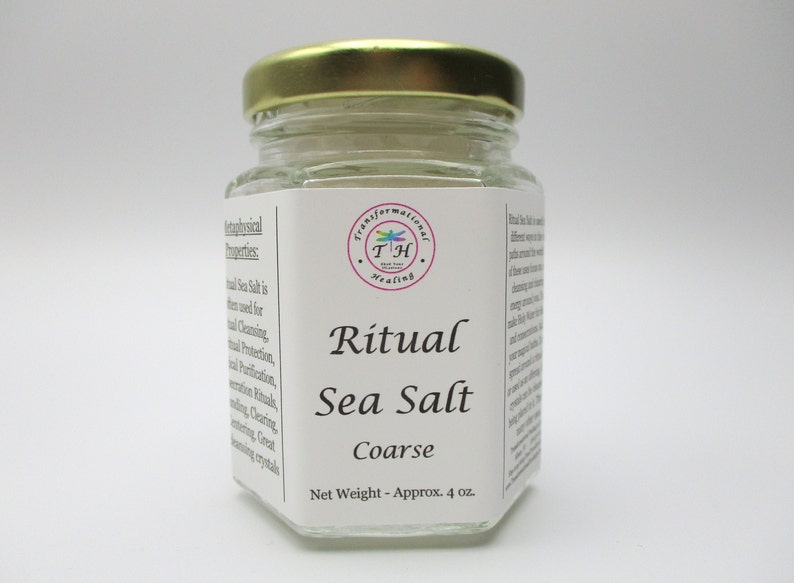May include: A glass jar with a gold lid filled with coarse sea salt. The label reads "Ritual Sea Salt Coarse" and "Net Weight - Approx. 4 oz."