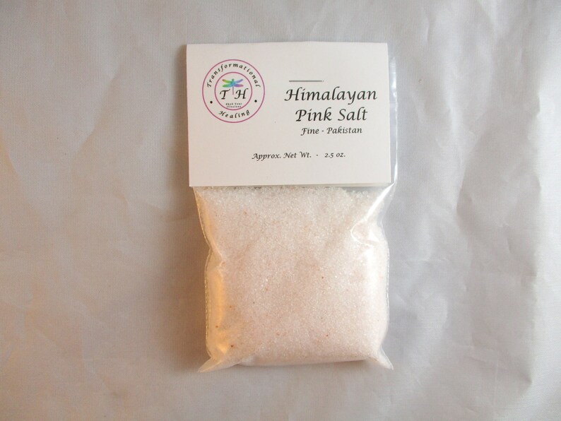 May include: A small white bag with a label that reads "Himalayan Pink Salt Fine - Pakistan Approx. Net Wt. - 2.5 oz." The bag contains fine pink Himalayan salt.