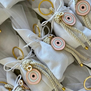 Christening bomboniere / favour pouch and rope keyring with Mati and cross