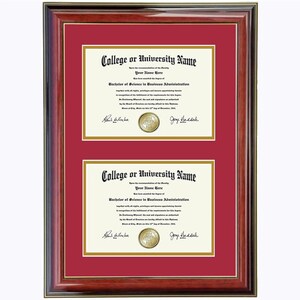 May include: A mahogany wood frame with a red mat and gold trim holds two diplomas. The diplomas are for a Bachelor of Science in Business Administration from College or University Name. The diplomas are signed by the President and the Dean.