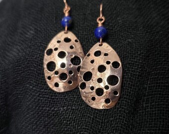 Bright, handcrafted ovoid copper earrings with holes and lapis beads