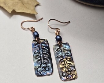 Hand hammered, embossed copper flower earrings with blue tones
