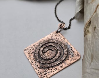 Textured copper swirl pendant necklace with copper colored chain