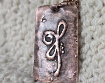 Celtic symbol of strength and perseverance in embossed copper pendant.