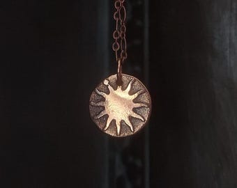 Small sun pendant necklace etched in copper