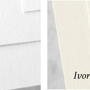 May include: Two paper samples, one white and one ivory, showing the texture of the paper. The paper has a subtle, textured surface.