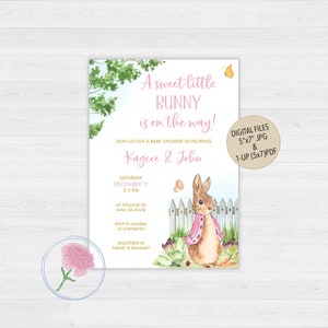 May include: A baby shower invitation with a watercolor illustration of a bunny wearing a pink jacket. The invitation is for Kaycee & John and is set for December 11th from 2-5 PM. The invitation includes the address, RSVP information, and registry details.