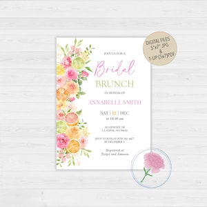 May include: A white bridal brunch invitation with a watercolor floral design featuring pink and yellow flowers, citrus fruits, and green leaves. The text reads "Join us for a Bridal Brunch in honor of Annabelle Smith, Sat | 12 | Dec at 10:30 am, 113 Genesee Dr, La Verne, MA 91650, RSVP to Judy at (879) 261-4477 by December 5, Registered at Target and Amazon".
