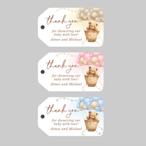 May include: Three white thank you tags with a brown teddy bear in a hot air balloon. The balloons are pink, blue, and beige. The text on the tags reads "thank you for showering our baby with love! Aimee and Michael."