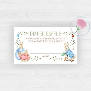 May include: A white diaper raffle card with watercolor illustrations of Peter Rabbit characters. The card reads "DIAPER RAFFLE" and includes the text "BRING A PACK OF DIAPERS, ANY SIZE FOR A CHANCE TO WIN A PRIZE!" and a space for a name.