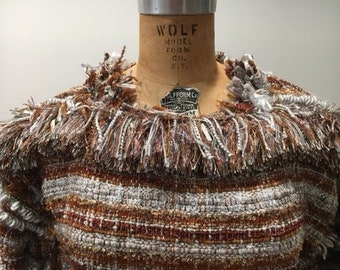 Hand woven pullover top.